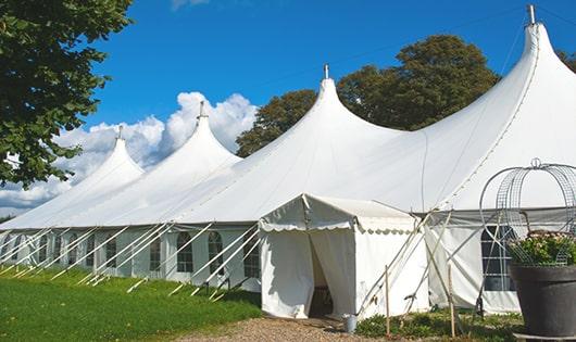 a line of sleek and modern portable toilets ready for use at an upscale corporate event in Felton